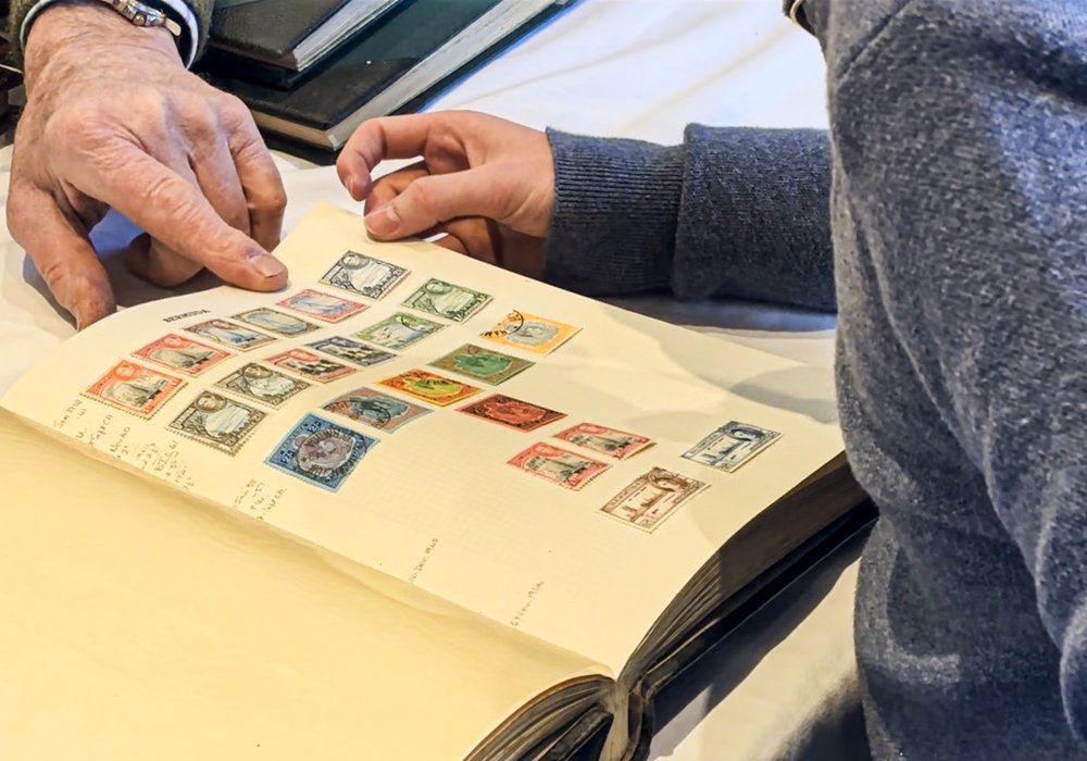 A stamp album examined at a valuation day